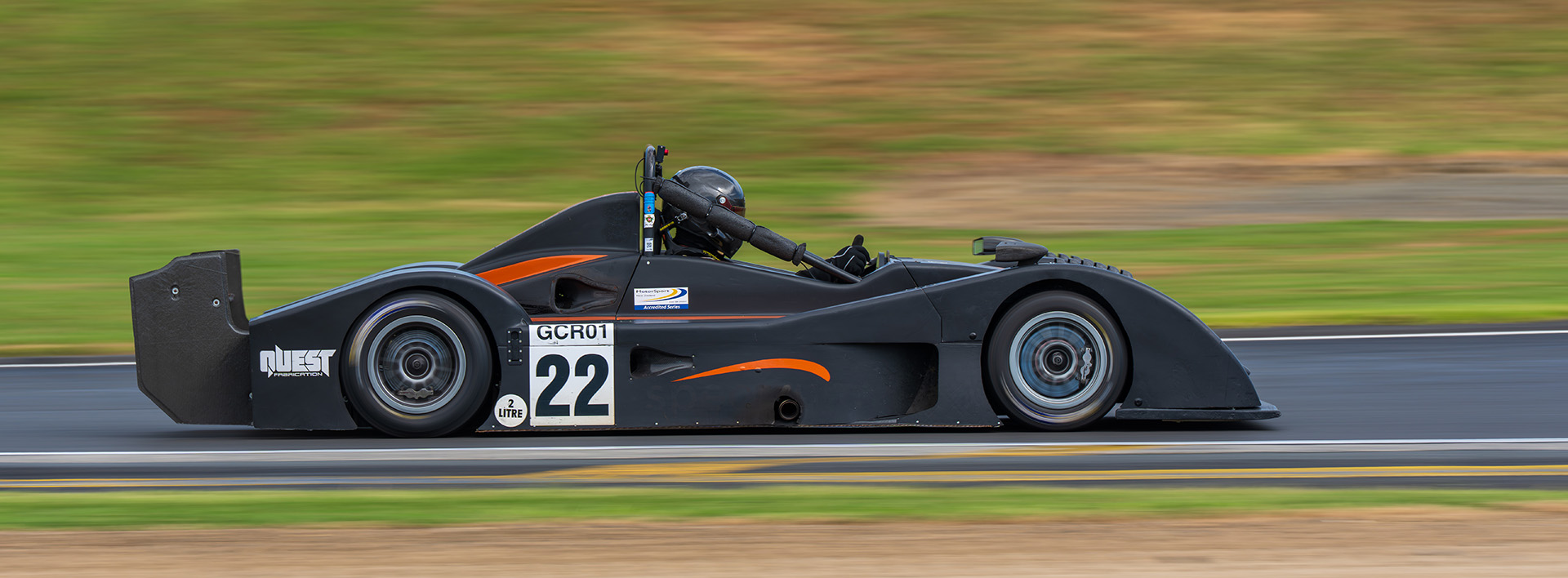 Open wheel sports racer at speed — motorsport photography by Ryan Watkinson